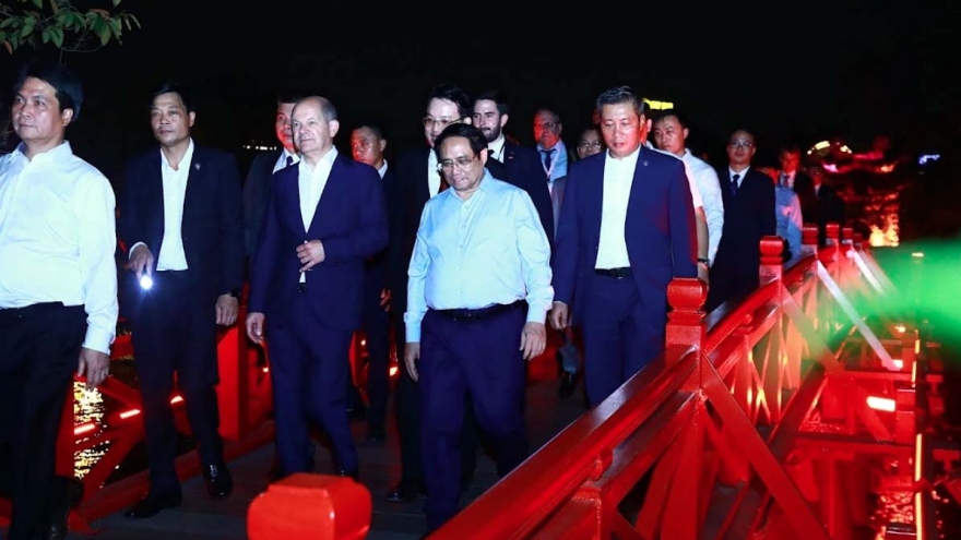 German chancellor Olaf Scholz takes night walk around Hanoi lake